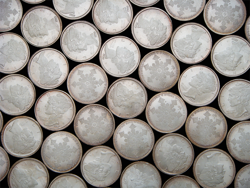 Silver Snow Crystals from 1999 Mintage arranged in the hexagonal pattern that forms naturally when circles are places in close proximity.